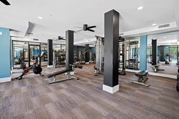 Cardio and strength training fitness center with peloton bike and lifefitness equipment
